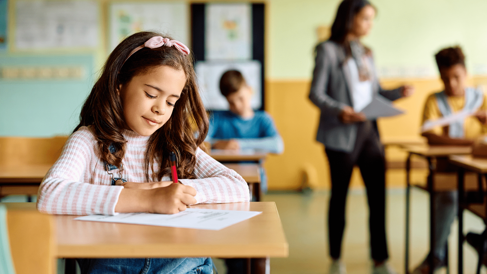 girl writing in school
